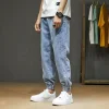 Men's spring and autumn jeans, a trendy Japanese loose-fitting and casual style with a halun leg, a trendy nine-inch corset details Picture